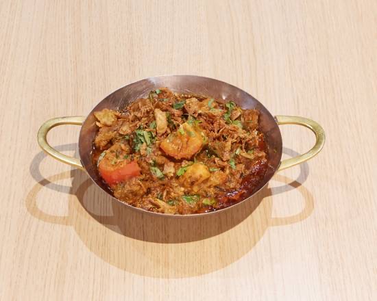 Karahi, served in the pan it is cooked in