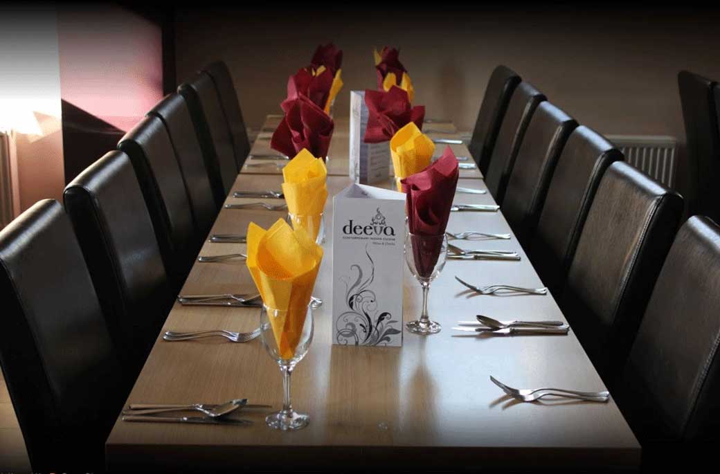A table set for dinner in Deeva's converted-church dining room